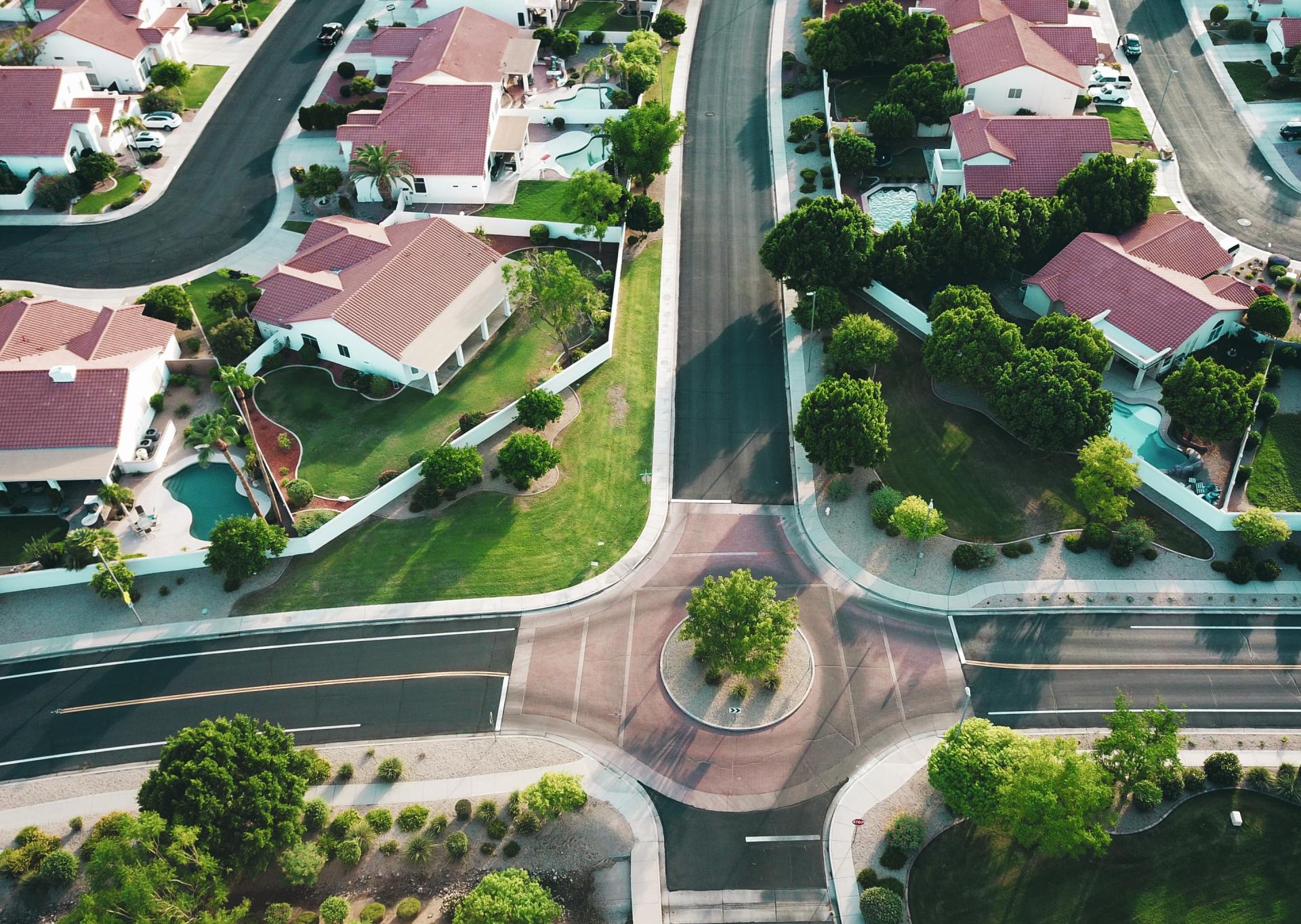 A overhead view of a neighborhood and the top of homes